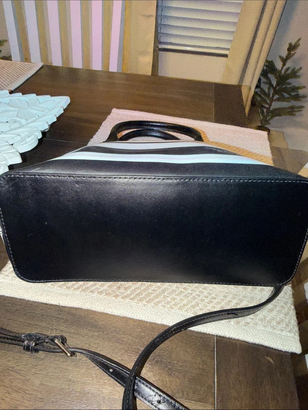 Kate Spade Grove Street Carli Satchel features a classic look